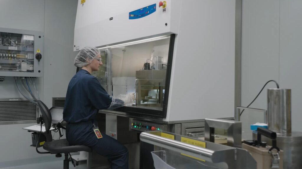 A BWXT Medical employee eluting technitium-99m in BWXT's patented generator.